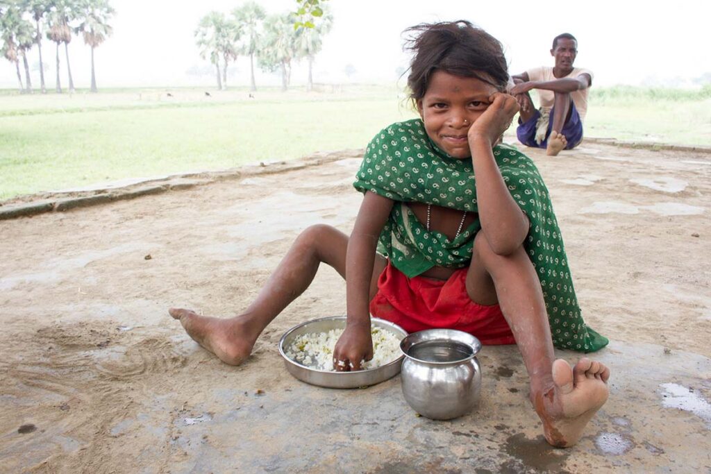 A girl eats rice