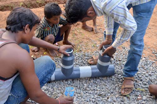 Indian men put together pipes