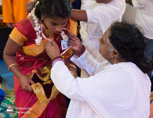 Amma arranges the jewlery of a bride