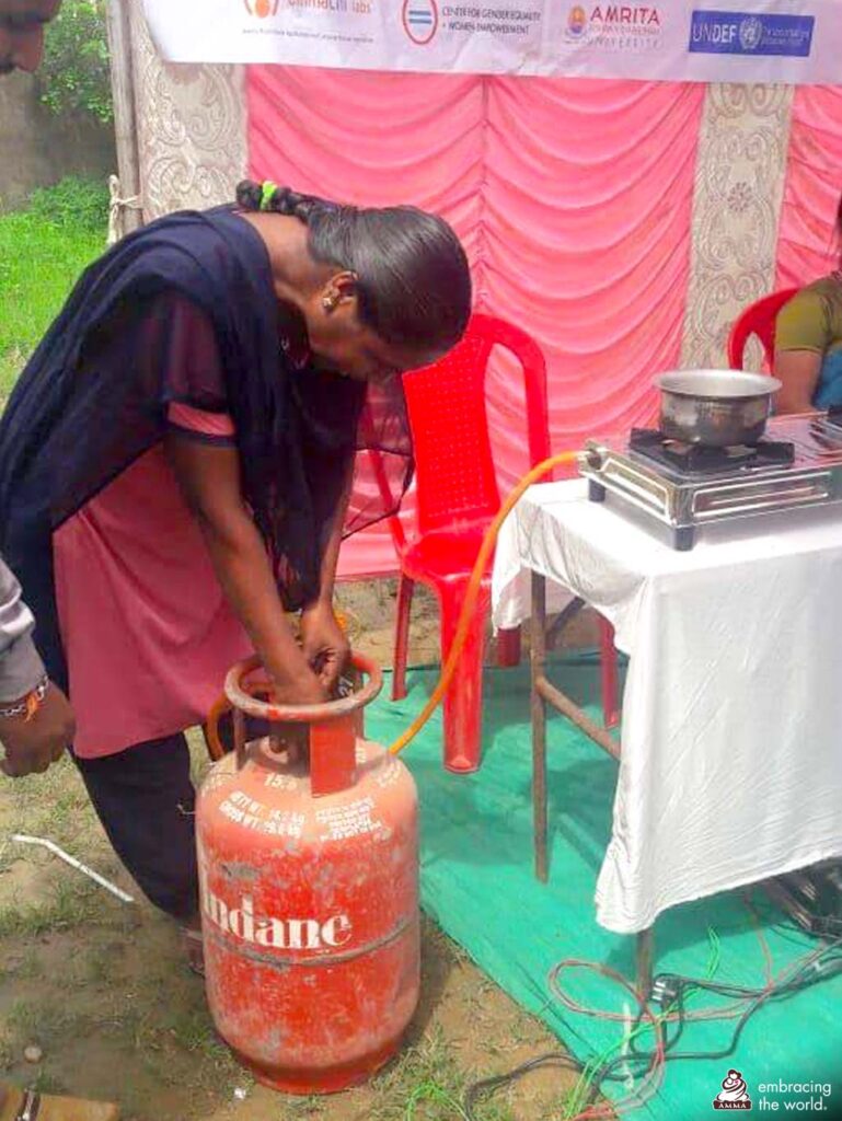 Woman connects a stove to a gas cylinder