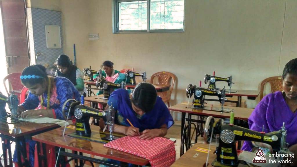 Women studying tailoring in a classroom