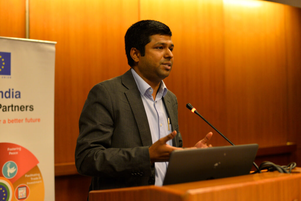 Dr. Shyam Diwakar speaking a podium
