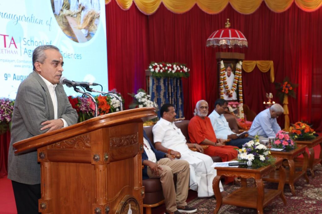 Swami and special guests listen to the other speakers