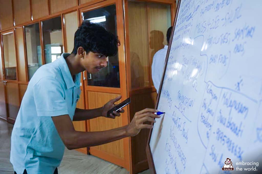 A volunteer writes on a board