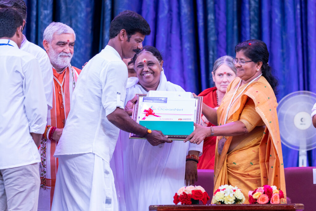 Amma gives device to fisherman