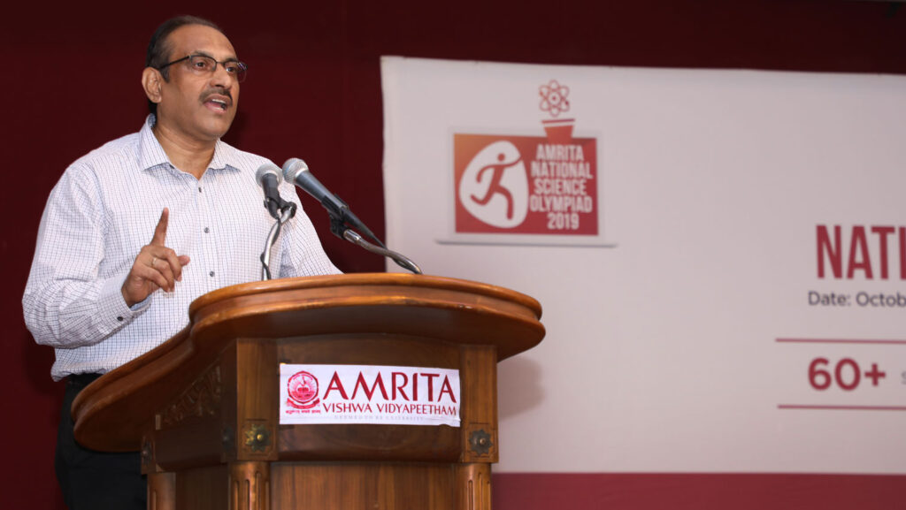 Teacher speaks to students at a podium