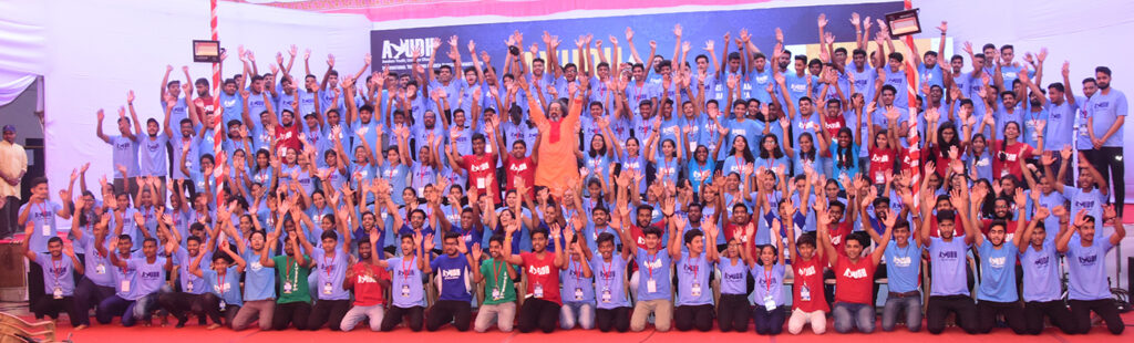 200 plus students pose for a group photo with Swami Amritaswarupananda Puri