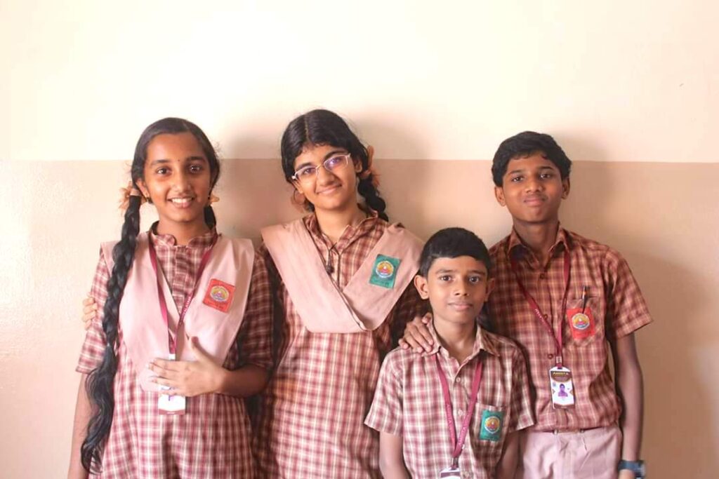 Students stand together in their uniforms