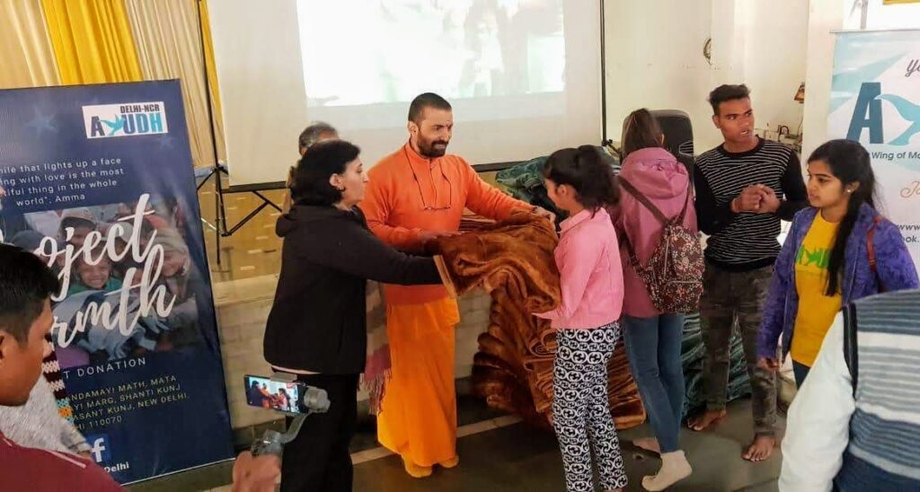 Children wait to receive blankets