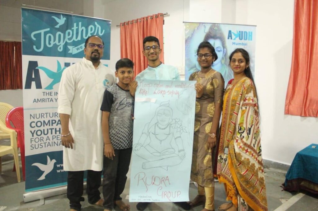  A proud Indian family holds up their poster board depicting a large drawing of  Shiva as Rudra.