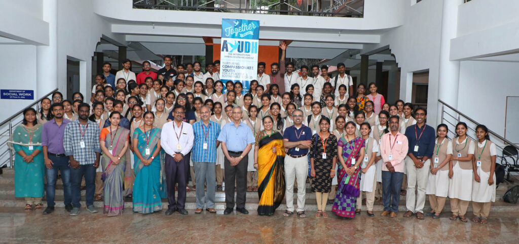 Students and staff gather for photo