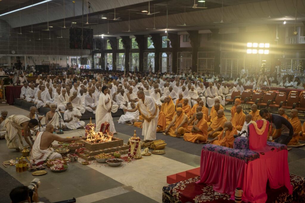 Before Amma arrives, a special homa is performed in front of her peetham, as all the initiates and audience attend.