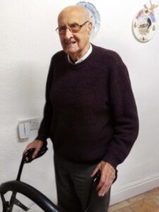 Oldest participant stands with his walker