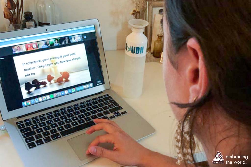 Young woman sits at her computer