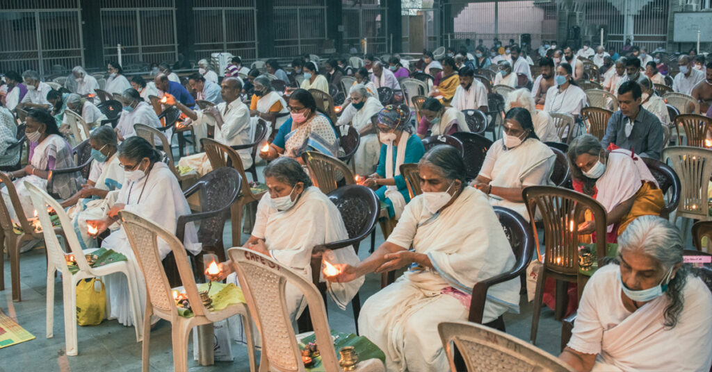 People of all ages sit to participate