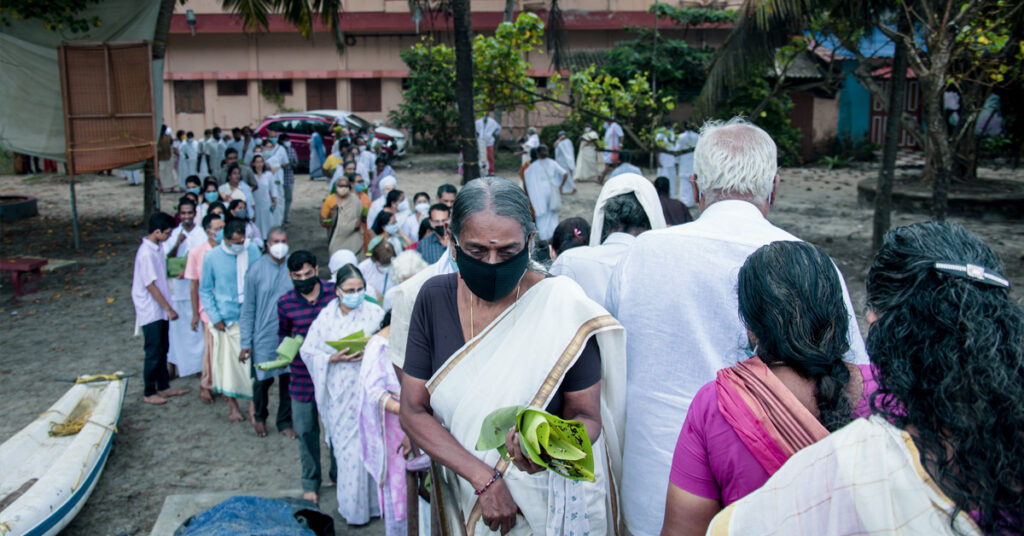 After the puja, participants walk to the beach