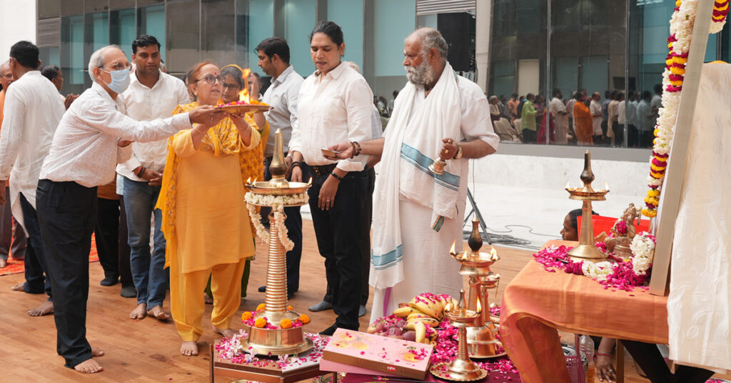 Devotees wave arati tray