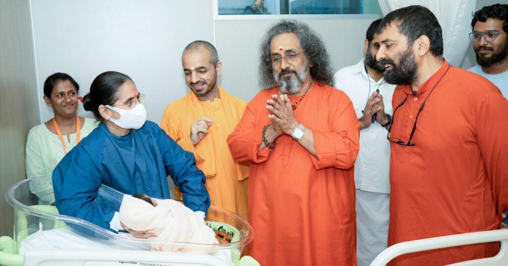 Swamiji greets woman who just had surgery