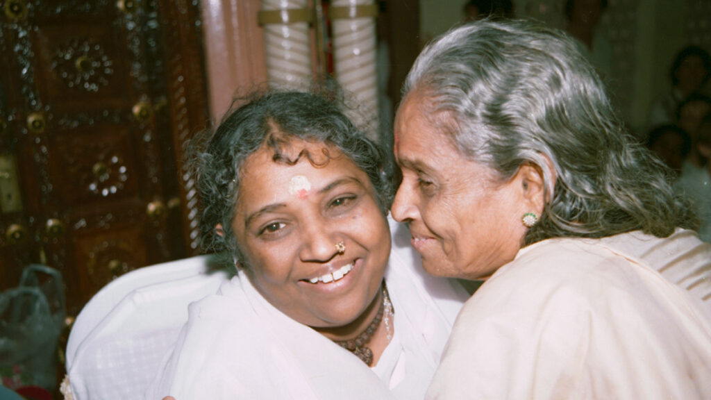 Amma and her mother embrace