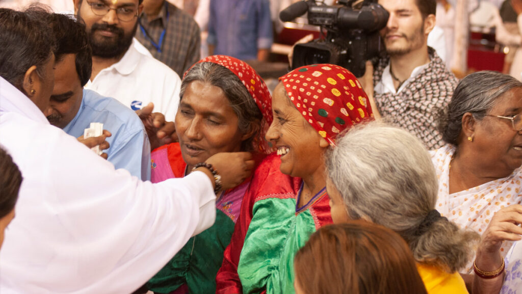 Amma gives darshan to village women