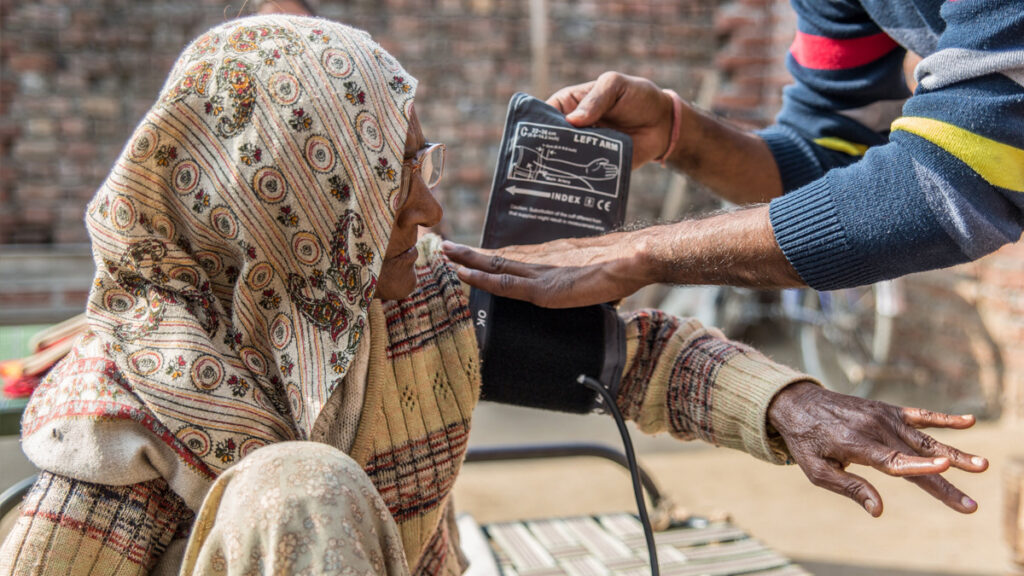 Village woman gets her blood pressure taken