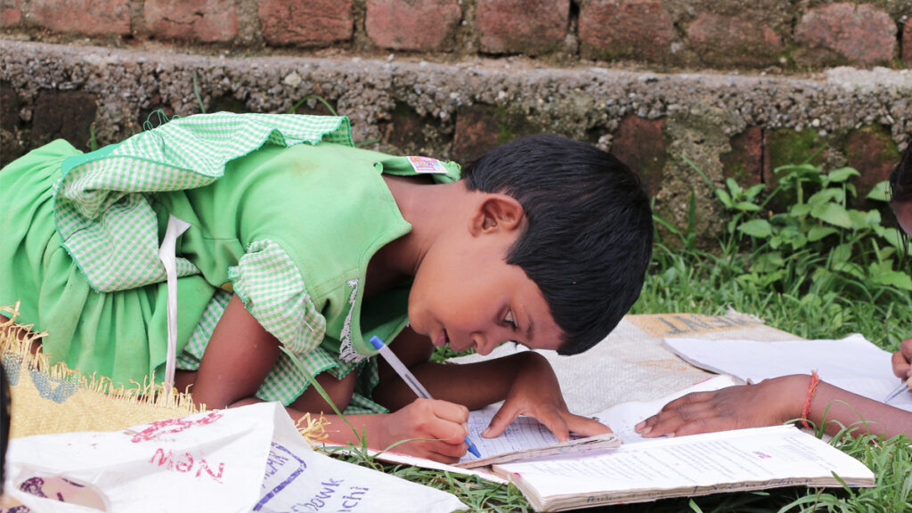 A student writes in notebooks