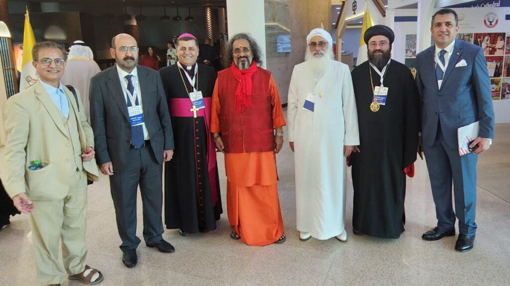 Swamiji stands with religious leaders from various faiths