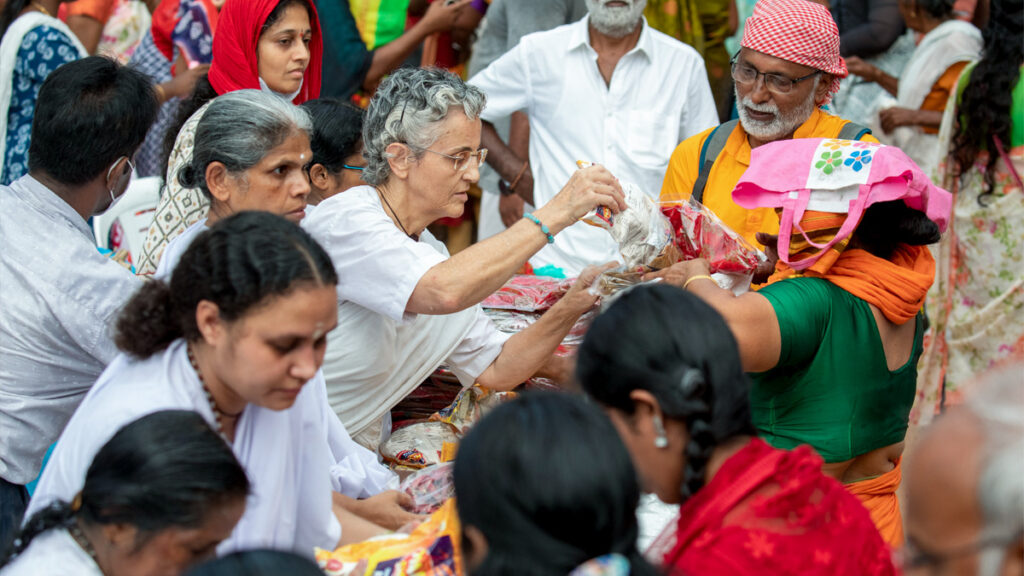 International volunteers pass out food items