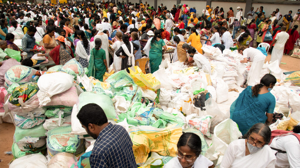 Huge piles of rice and lentils waiting for distribution