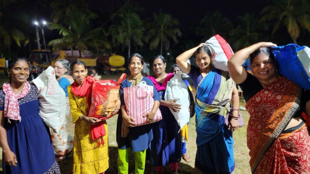 Women stand and smile at the end of the event