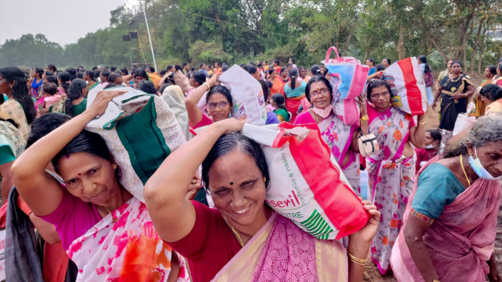 Women hold their bags on their shoulders