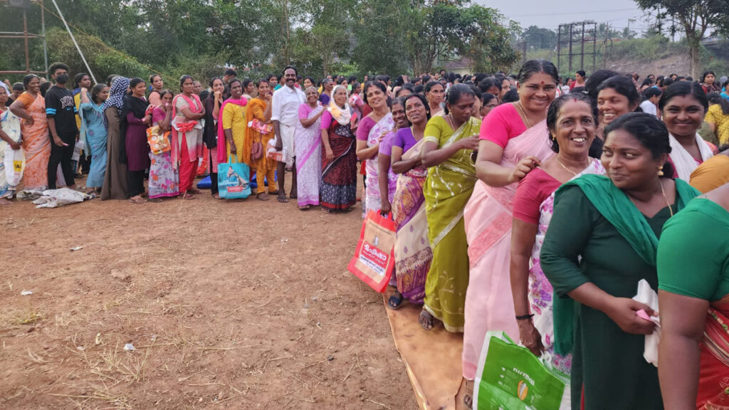 Women wait in line to receive their aid