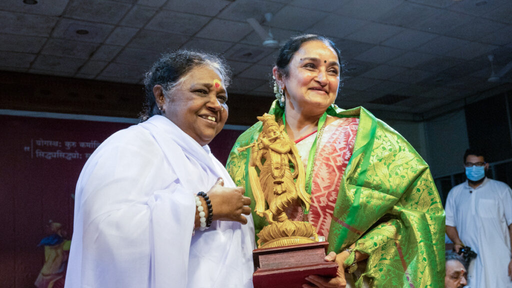 Amma and Dr Sandhya stand together and smile