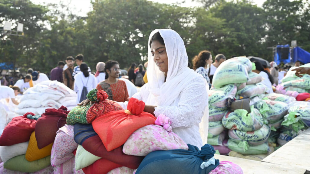 Volunteers sort bags of rice