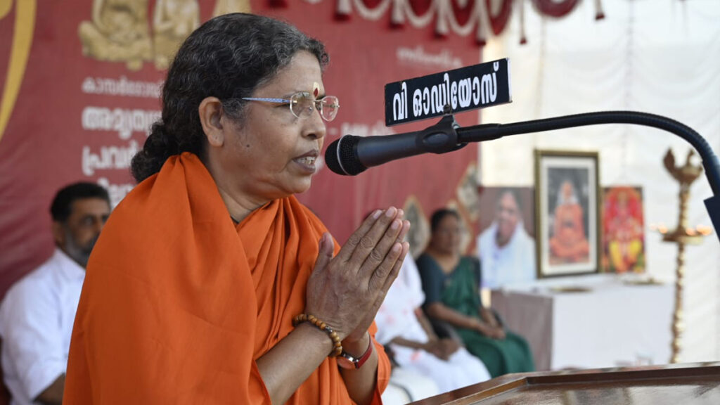 Swamini prays before speaking