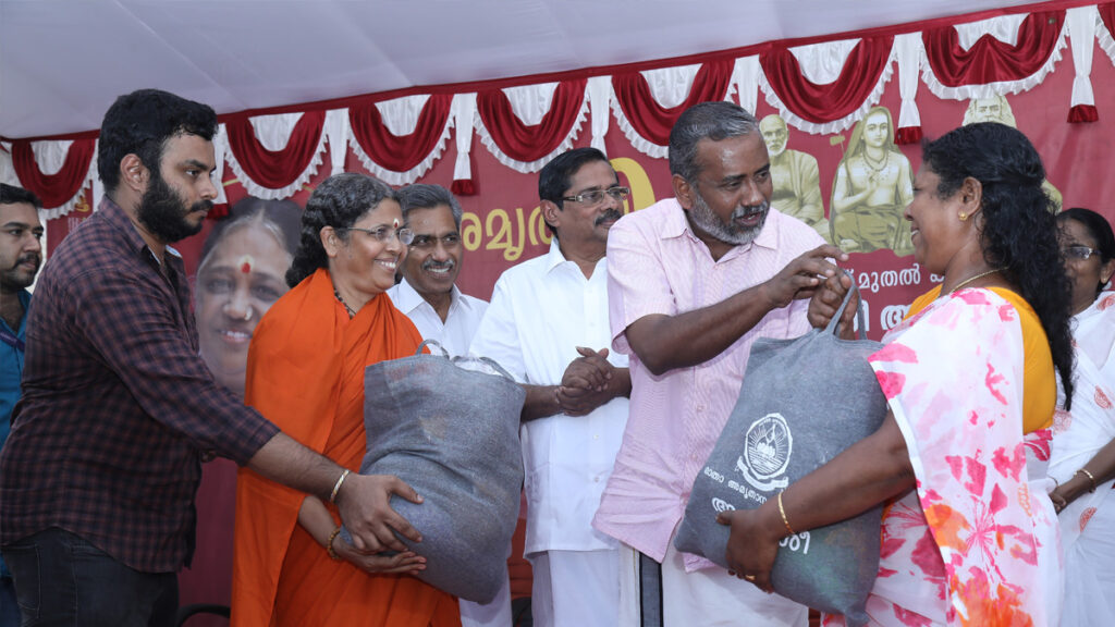 Minister and Swamini distribute aid