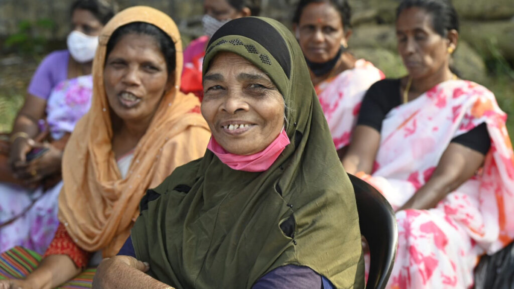 Women from various backgrounds sit together