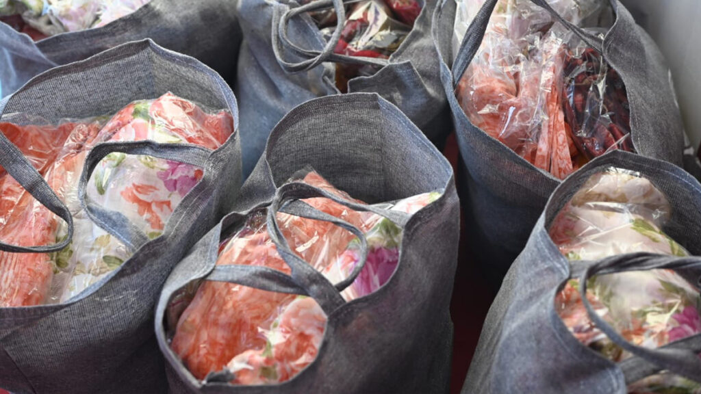 Bags are full of food items and saris