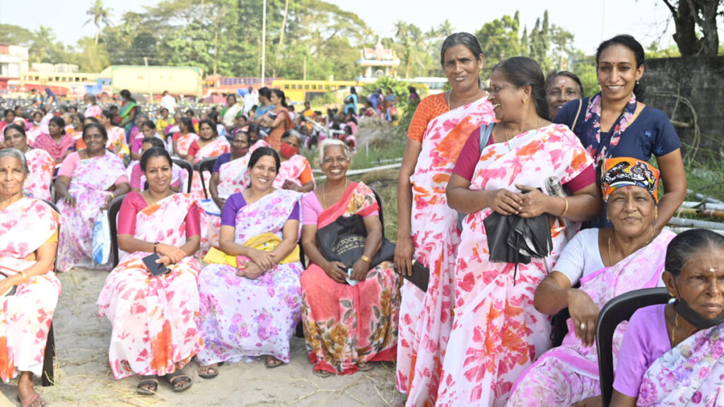 Women sit and listen to talks