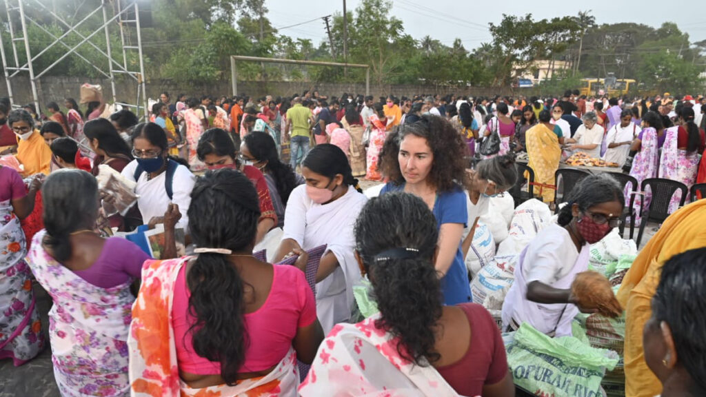 Voluteers from around the world pass out dry food items