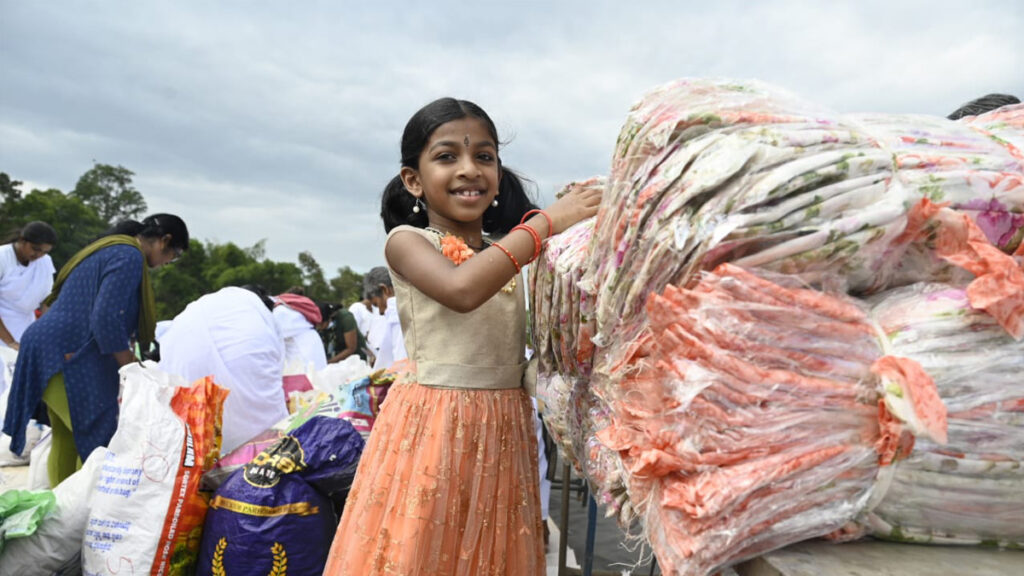 Girl opens packet of saris