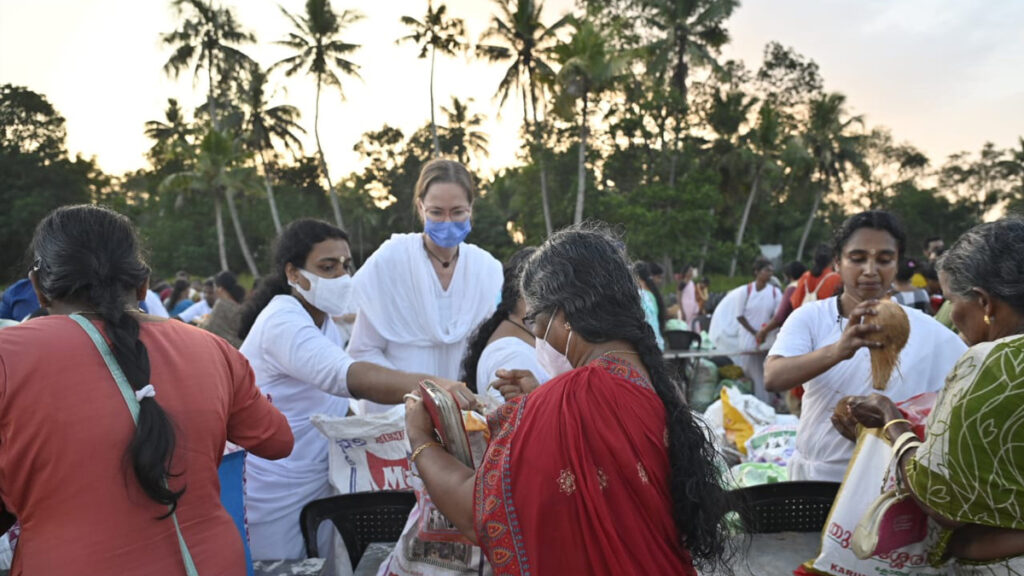 International volunteers pass out food items