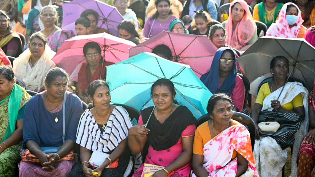 Huge crowd of women sit and smile