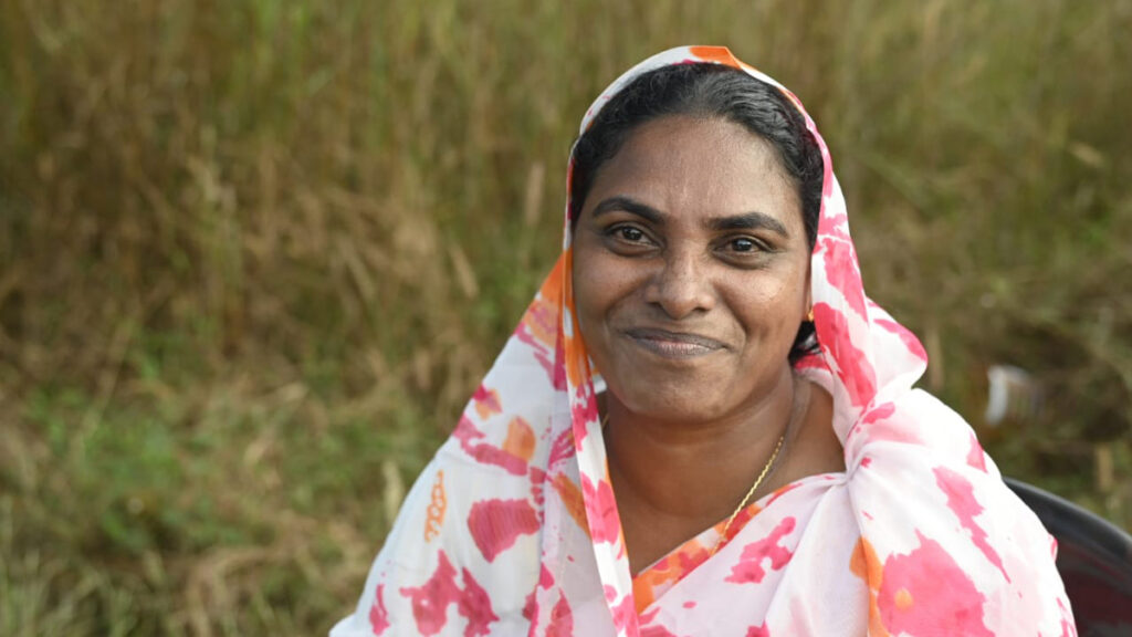 Woman smiles into camera