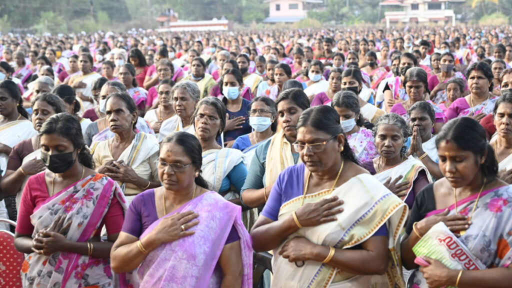 Women stand in honor of lamp lighting