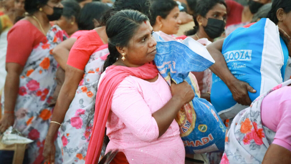 Mother walks with a bag of food