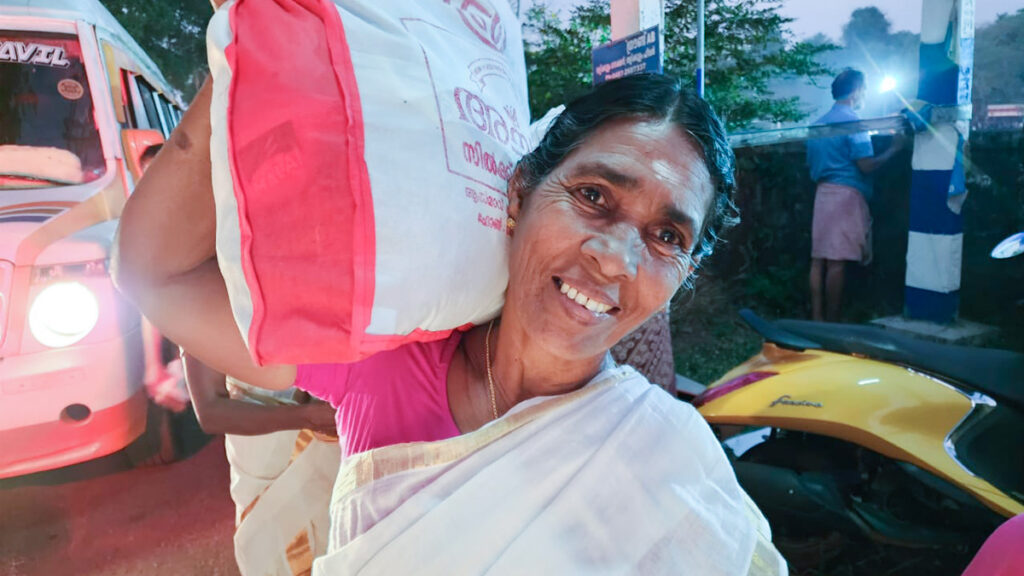 Woman carries her aid on her shoulder