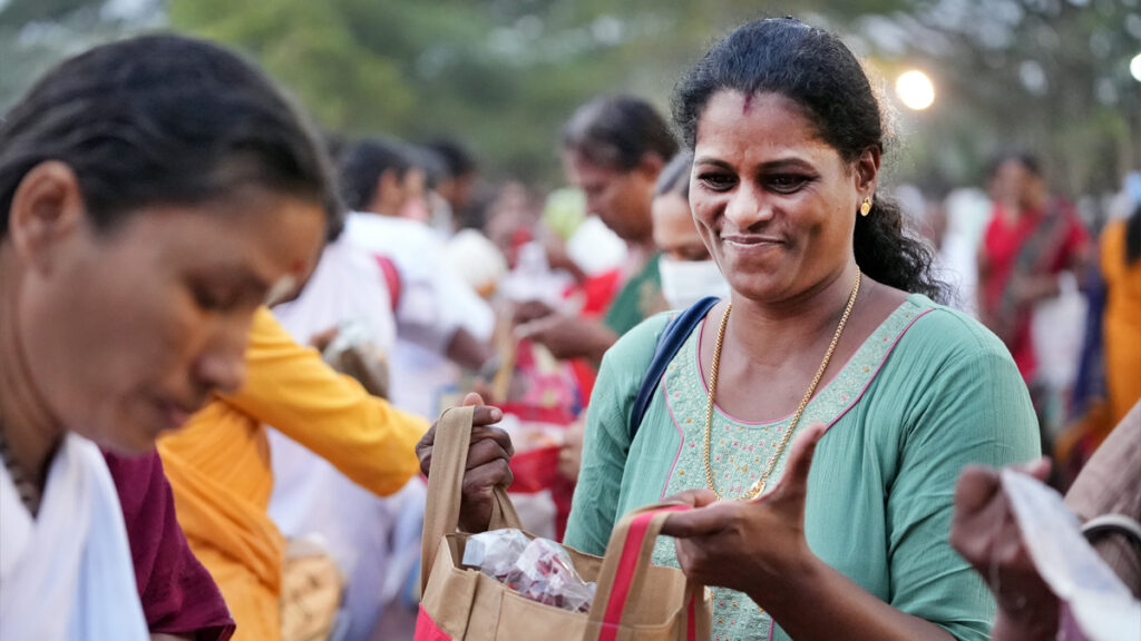 Women filling their bags with supplies