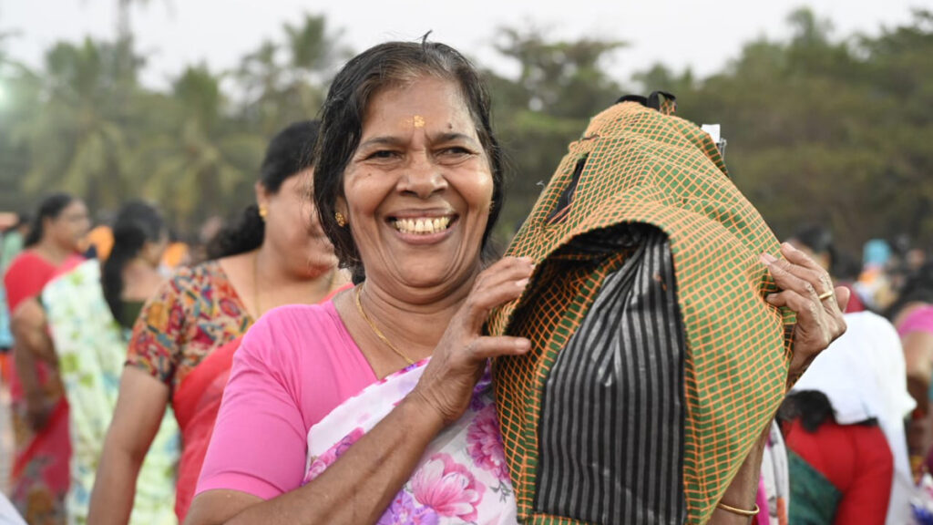 Women happily hold their bags