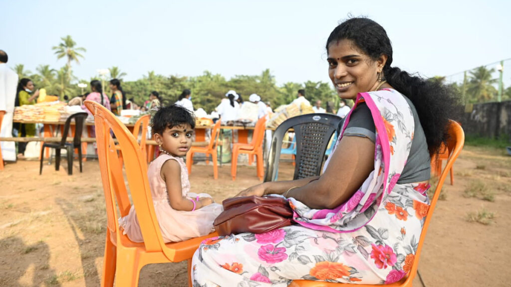 Mother and daughter smile at the event